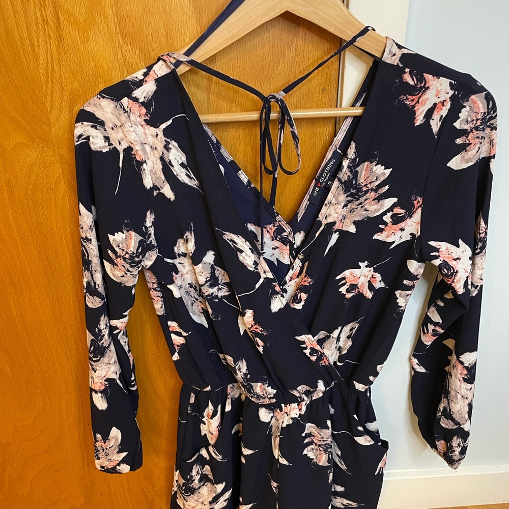 Navy and white pattern long sleeve romper with tie on back size small
